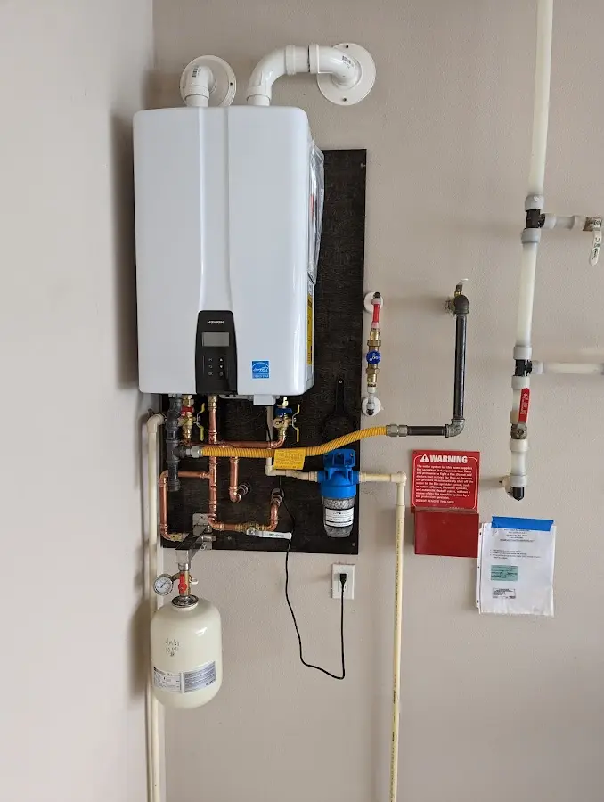 Professional plumber installing copper piping in a Steamboat Springs home